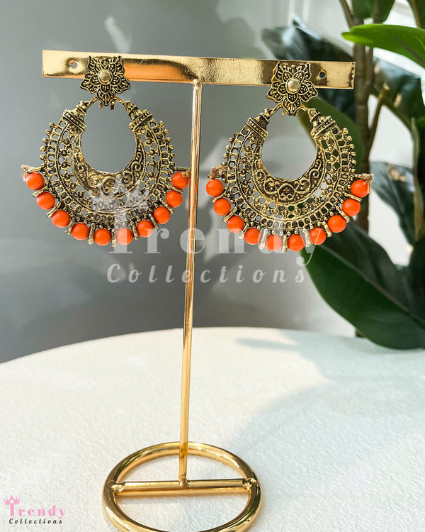 GOLDEN COLOUR CRESCENT MOON SHAPED KUNDAN EAR RINGS WITH ORANGE PEARL DROPS